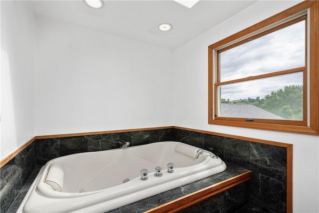 full bath with a jetted tub and recessed lighting