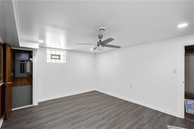 below grade area featuring electric panel, baseboards, ceiling fan, wood finished floors, and recessed lighting