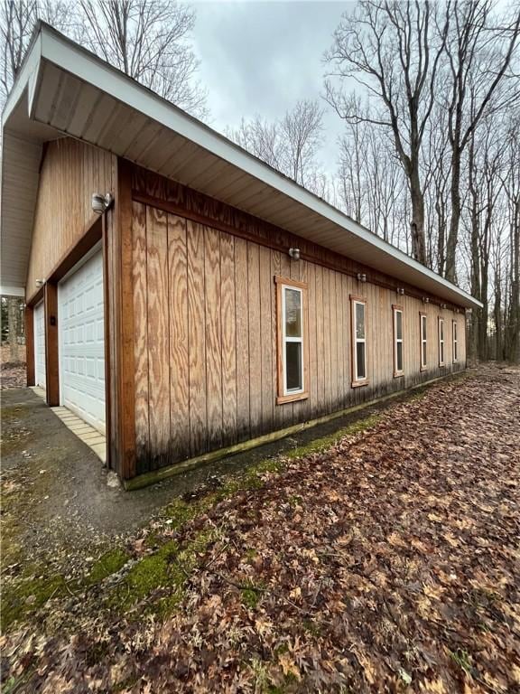 view of property exterior featuring a garage