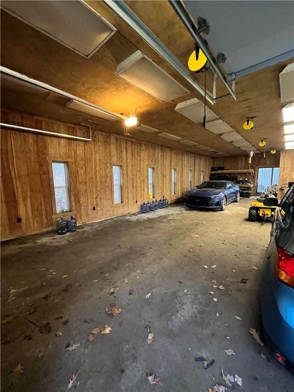 garage featuring wooden walls