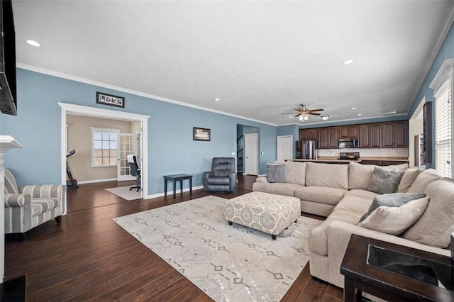 living room featuring ornamental molding, dark wood-style flooring, recessed lighting, and baseboards