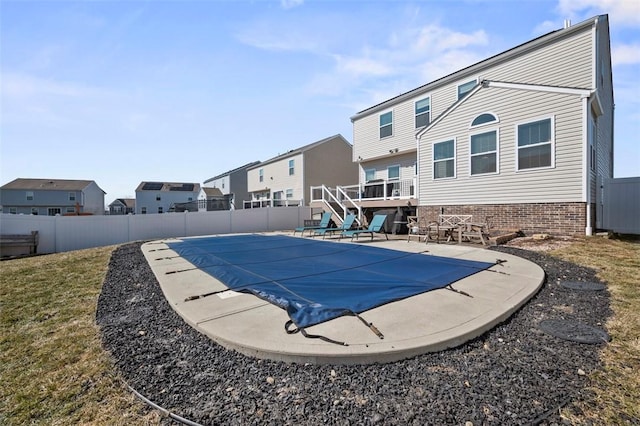 view of swimming pool with a patio, a fenced backyard, stairs, a residential view, and a fenced in pool