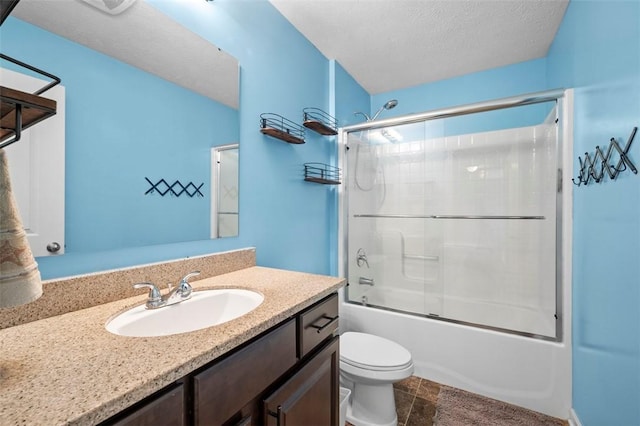 full bath with toilet, combined bath / shower with glass door, a textured ceiling, and vanity