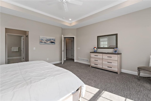 carpeted bedroom with ceiling fan, visible vents, baseboards, a tray ceiling, and crown molding