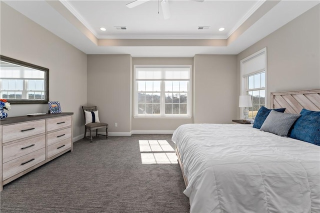 bedroom featuring carpet floors, baseboards, a tray ceiling, and ornamental molding