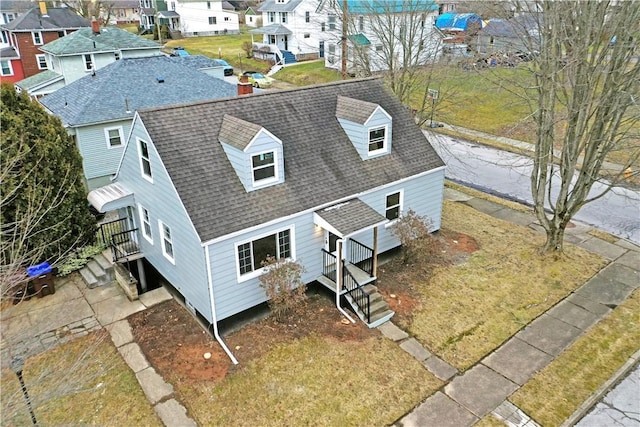 birds eye view of property with a residential view