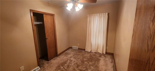 bedroom with a ceiling fan, visible vents, baseboards, a closet, and carpet