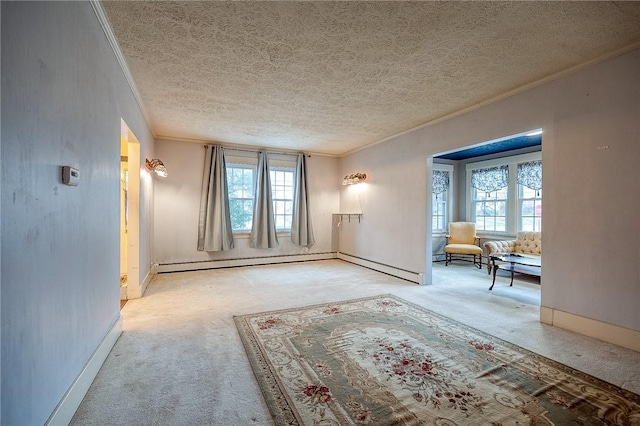 interior space with a baseboard heating unit, a healthy amount of sunlight, carpet flooring, and crown molding