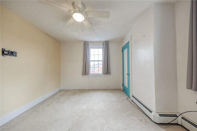 unfurnished room featuring baseboard heating, a ceiling fan, light carpet, a textured ceiling, and baseboards