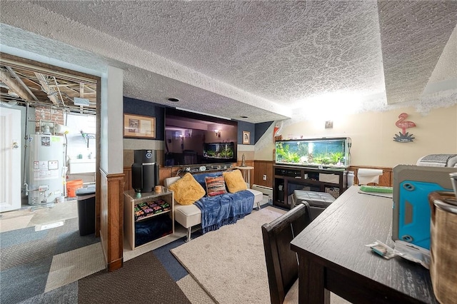 carpeted living area featuring wainscoting, water heater, a textured ceiling, and baseboard heating