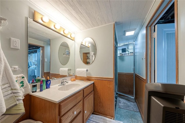 bathroom with wooden walls, wainscoting, wood ceiling, heating unit, and vanity