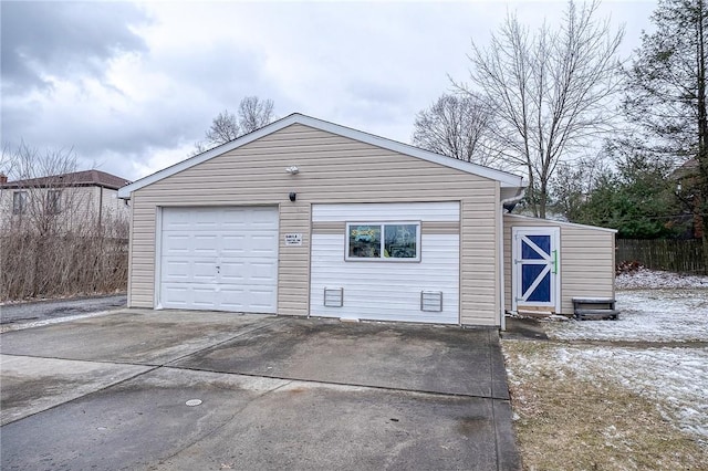 detached garage with concrete driveway