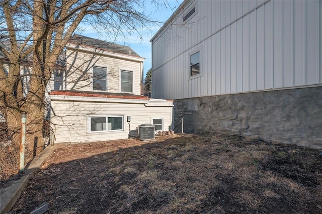 rear view of property featuring cooling unit