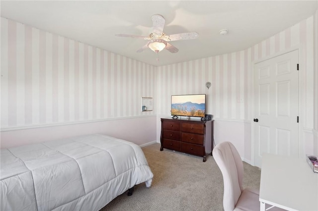 bedroom featuring carpet, ceiling fan, baseboards, and wallpapered walls