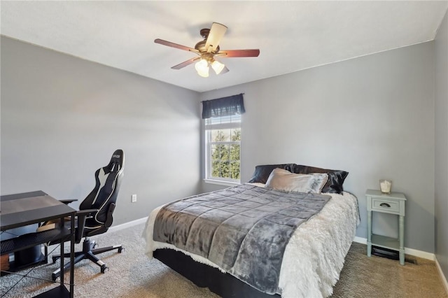 carpeted bedroom featuring ceiling fan and baseboards