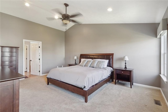 bedroom with baseboards, visible vents, a ceiling fan, light colored carpet, and lofted ceiling