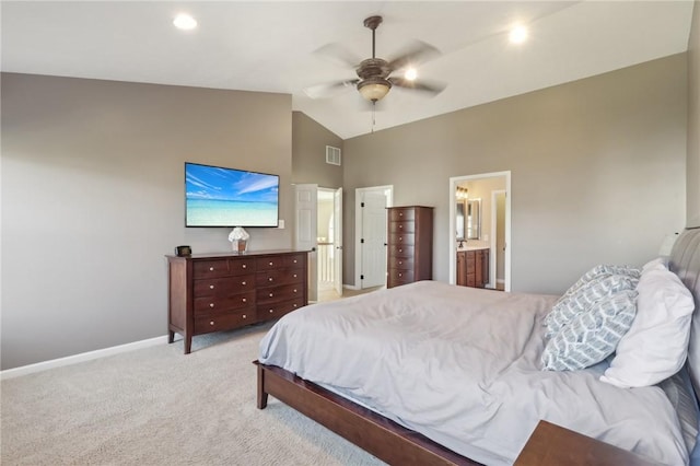 bedroom featuring visible vents, baseboards, light colored carpet, ensuite bathroom, and high vaulted ceiling