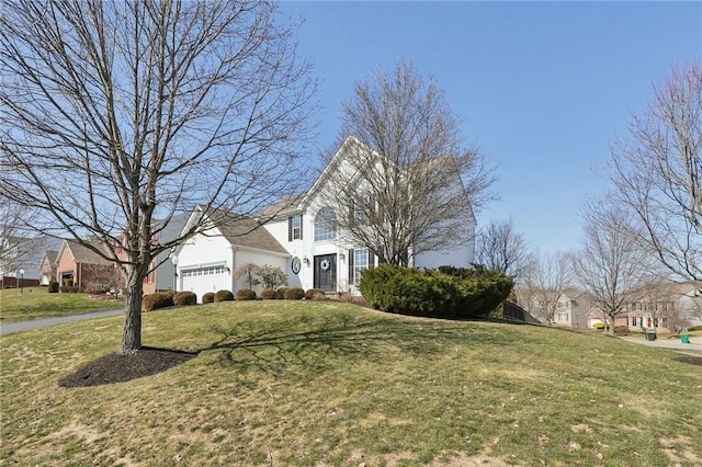 view of front of property featuring a garage, a residential view, and a front lawn