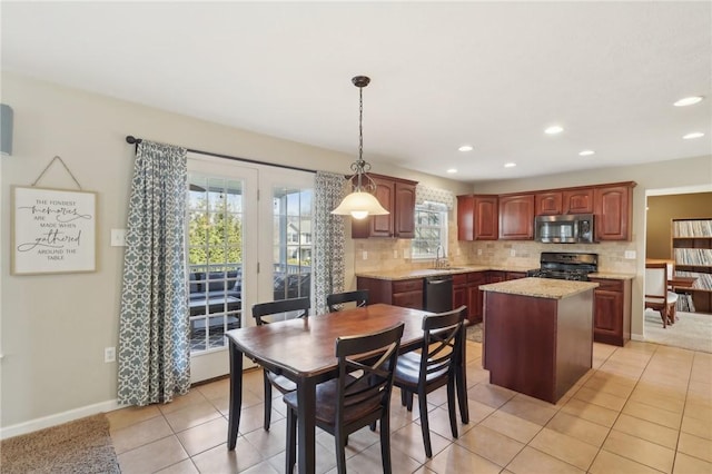 dining area with recessed lighting, baseboards, and light tile patterned floors