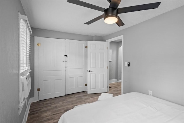 bedroom with a ceiling fan, a closet, and wood finished floors