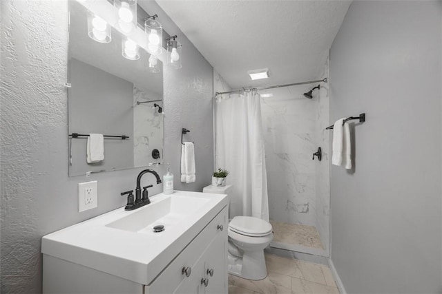 full bathroom with marble finish floor, vanity, a shower stall, and toilet