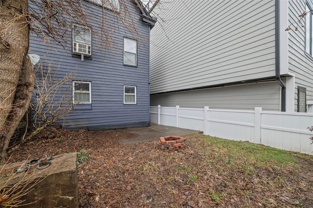 view of property exterior featuring fence