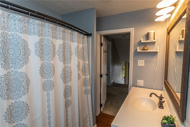 bathroom with a shower with curtain and vanity