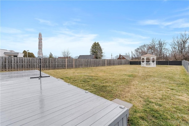 view of yard featuring a gazebo, a fenced backyard, and a wooden deck