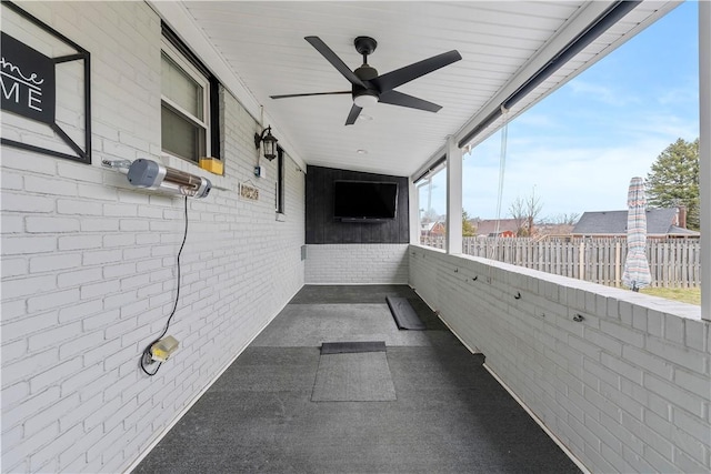 exterior space featuring a ceiling fan