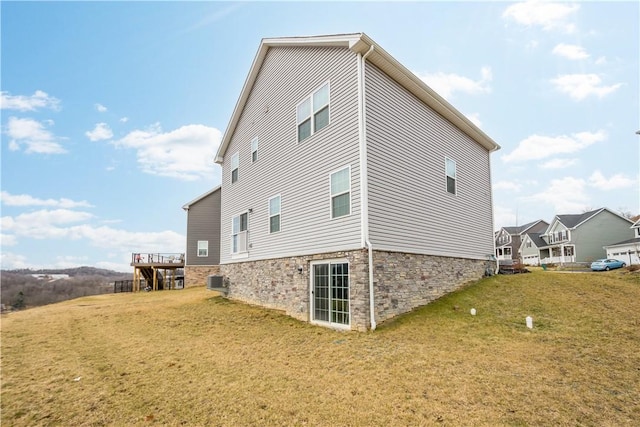 view of side of home featuring a yard