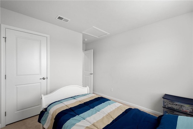 carpeted bedroom with attic access, visible vents, and baseboards