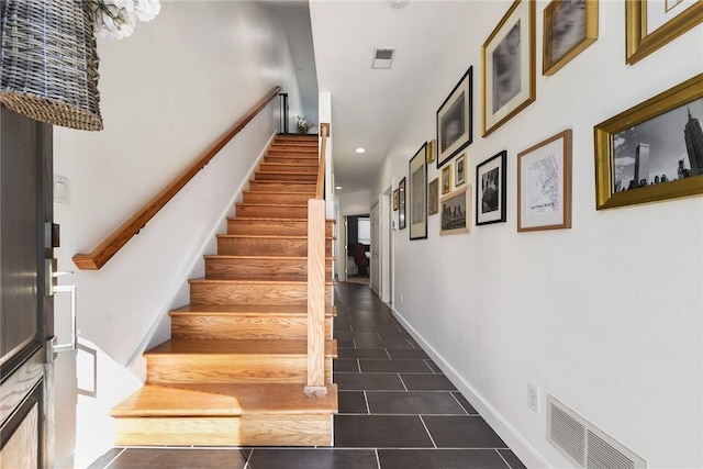 stairway featuring recessed lighting, visible vents, and baseboards