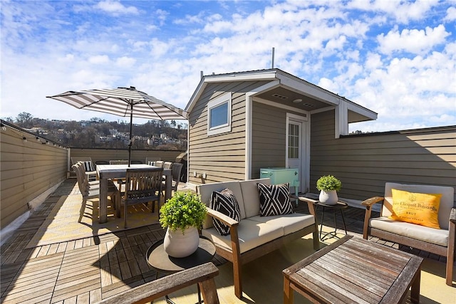 wooden deck featuring a patio area, outdoor dining space, outdoor lounge area, and fence