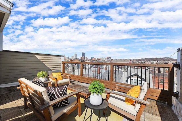 wooden deck with a view of city