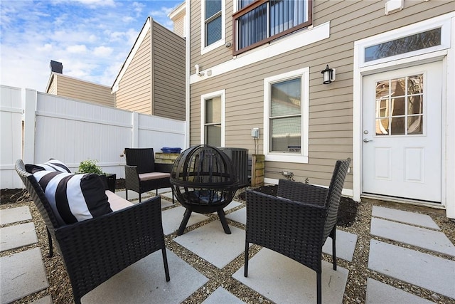 view of patio with outdoor lounge area and fence