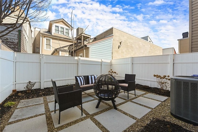 view of patio / terrace with an outdoor hangout area, a fenced backyard, and cooling unit