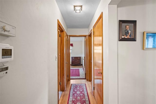 hallway featuring light wood-type flooring