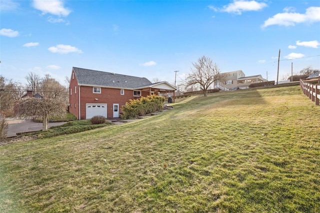 view of yard featuring an attached garage