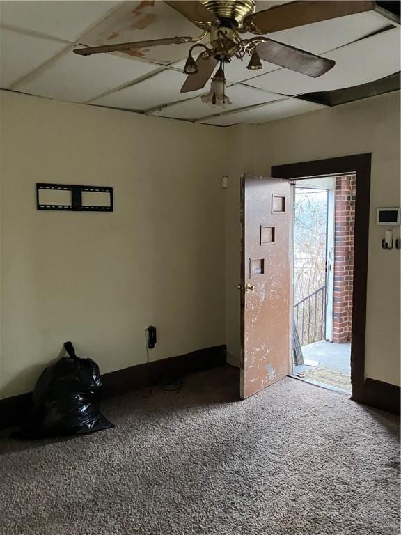 spare room featuring carpet and ceiling fan