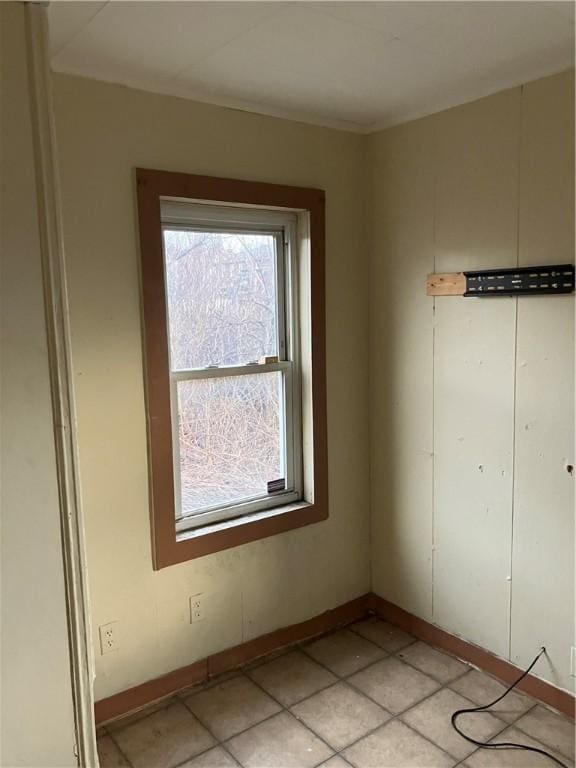 spare room featuring baseboards