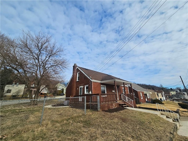 view of property exterior with a yard, fence private yard, a chimney, and brick siding