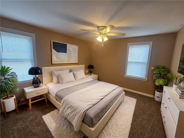 bedroom with ceiling fan and baseboards