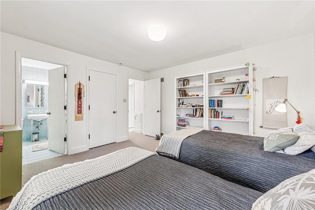 carpeted bedroom with ensuite bathroom