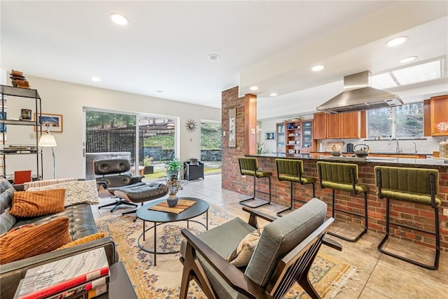 living room featuring recessed lighting and light tile patterned flooring