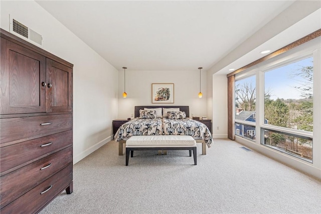 bedroom with light carpet, baseboards, and visible vents