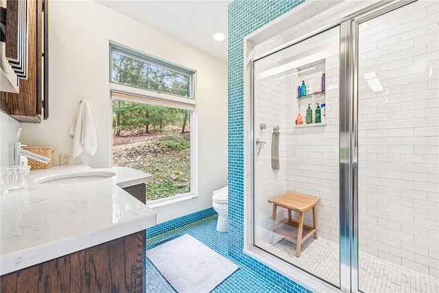 doorway with recessed lighting, a sink, a wealth of natural light, and tile patterned floors