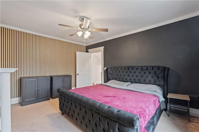 bedroom with ornamental molding, light colored carpet, and a ceiling fan