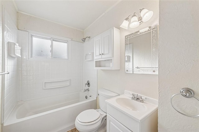 bathroom featuring washtub / shower combination, a textured wall, vanity, and toilet