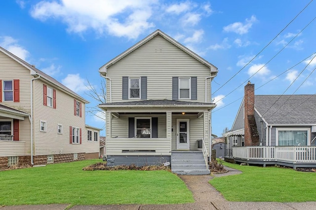 view of front facade with covered porch and a front yard