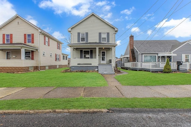 view of front of property with covered porch and a front lawn